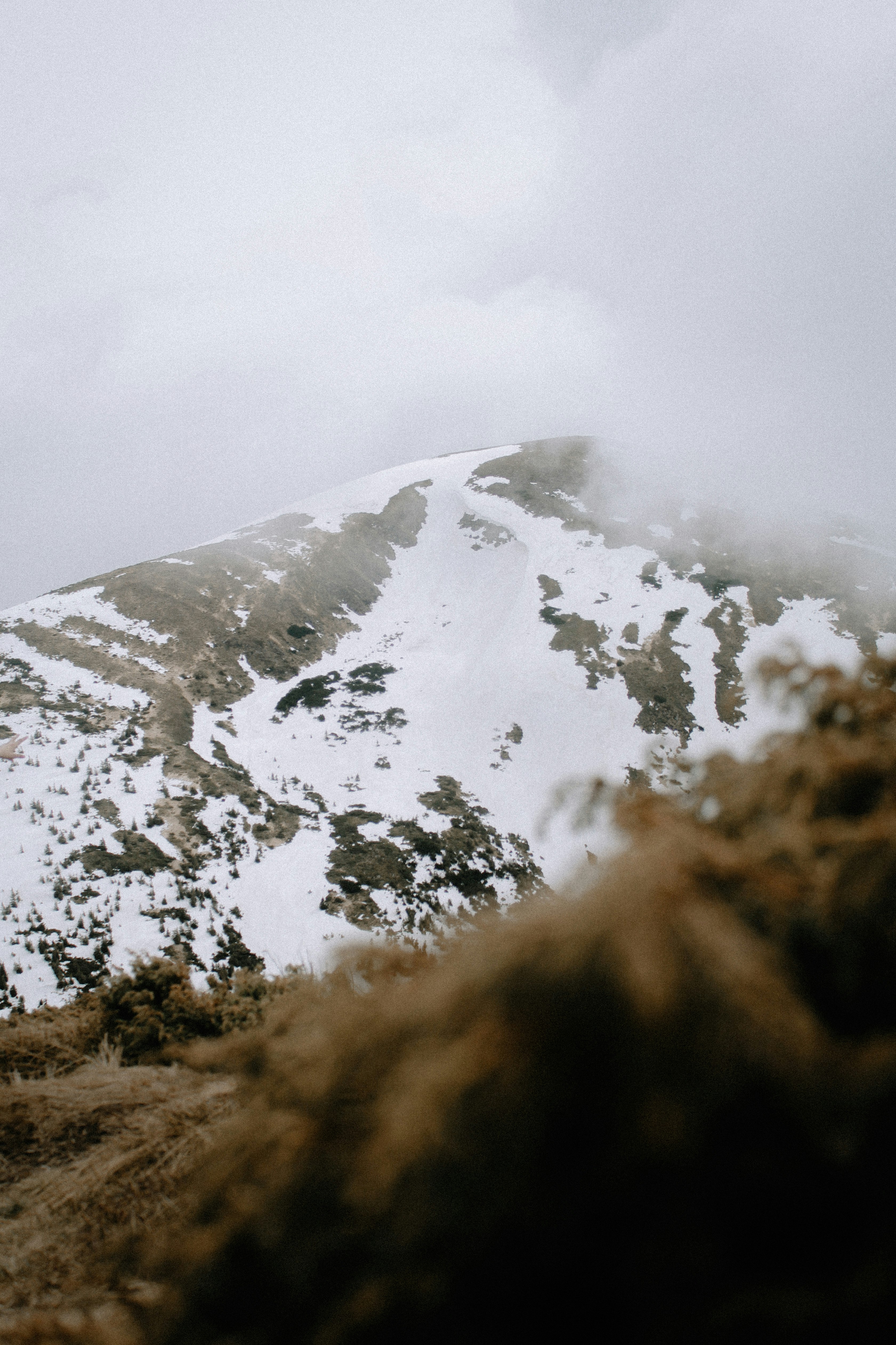 snow covered mountain during daytime